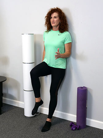 Tonya demonstrating an Unlock Your Spine exercise